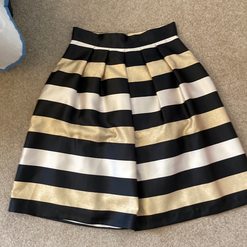 Dressy skirt, gold, black and cream horizontal stripes. Front and back pleats